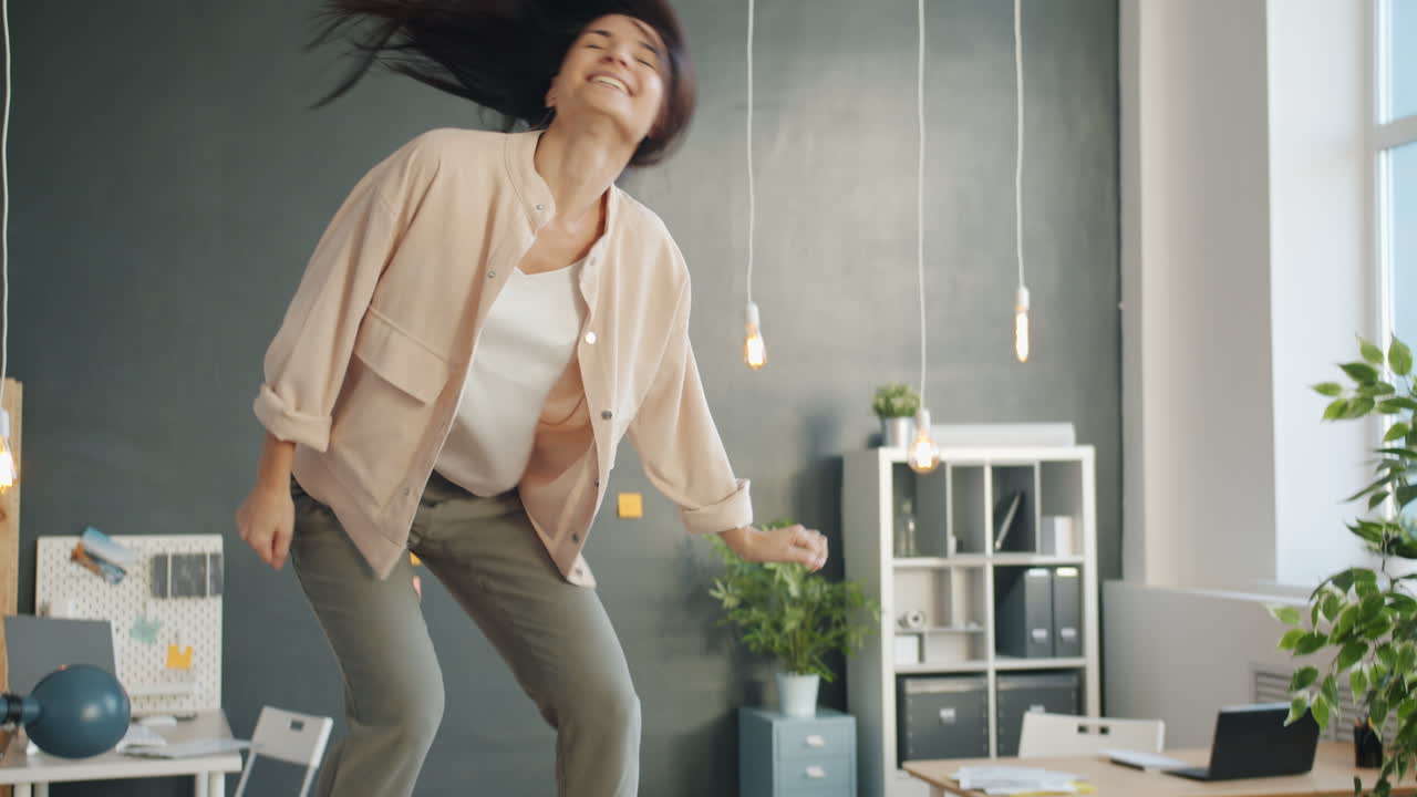 Woman Dancing in Office