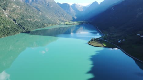 Areal-footage-of-glacier-lake-and-famous-Briksdalsbreen-glacier-in-Norway-at-the-end-of-it