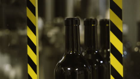 wine bottles on a conveyor belt in an industrial environment