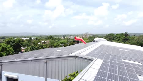 drone shooting of solar panels on a factory rooftop