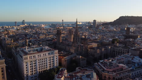 impressive aerial view of the waterfront cathedral of barcelona at sunset