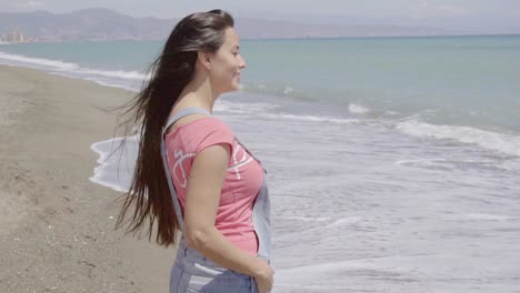 Front-view-on-lady-walking-along-beach