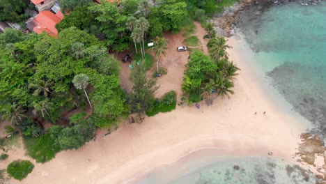 Slow-orbit-aerial-drone-shot-of-Ya-Nui-cove-in-the-South-side-of-Phuket-island,-a-provincial-tropical-paradise-in-southern-part-of-Thailand