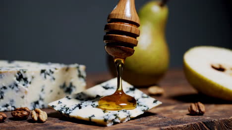 honey drizzled on blue cheese with pears and walnuts