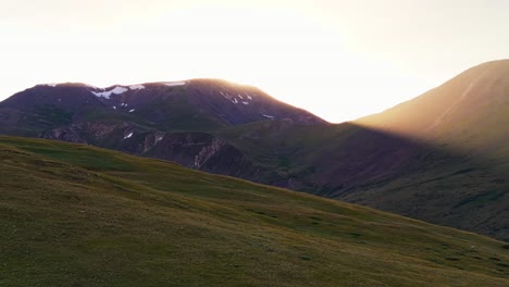 sunlight breaking over the rocky mountains, central colorado, pan right