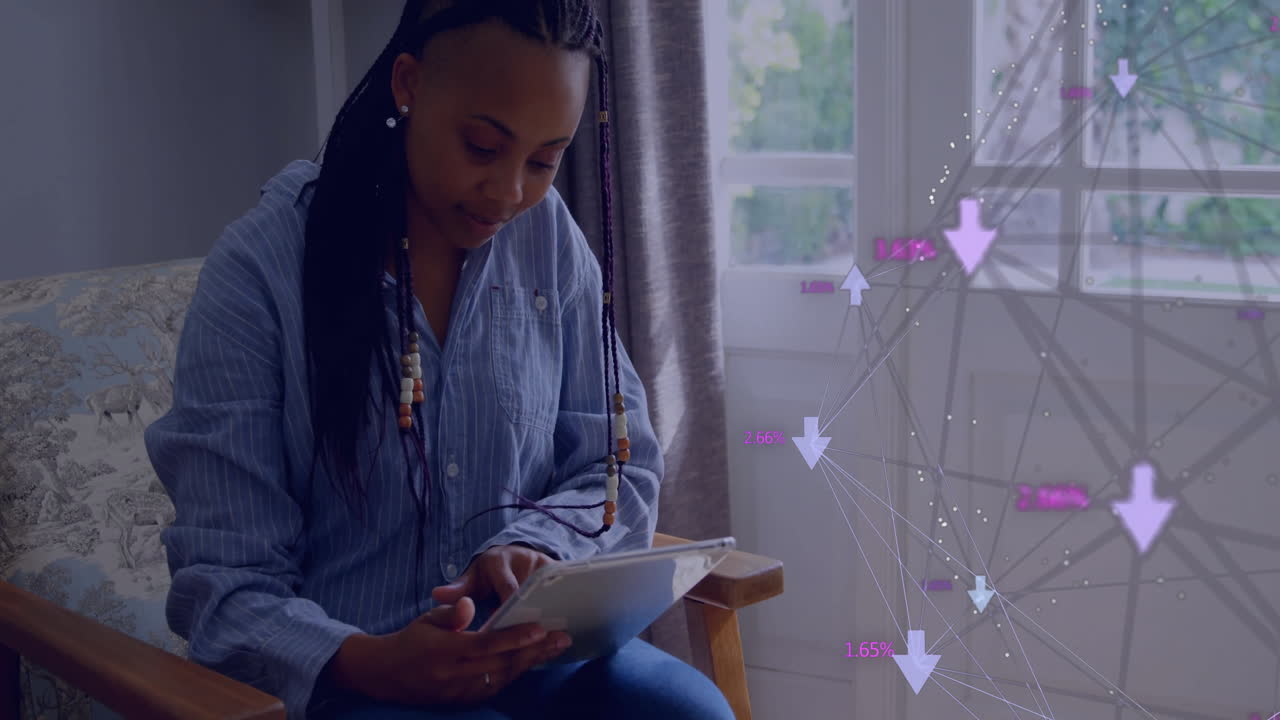 Woman sitting in wooden armchair reading tablet, showing finance chart with arrows and percentages