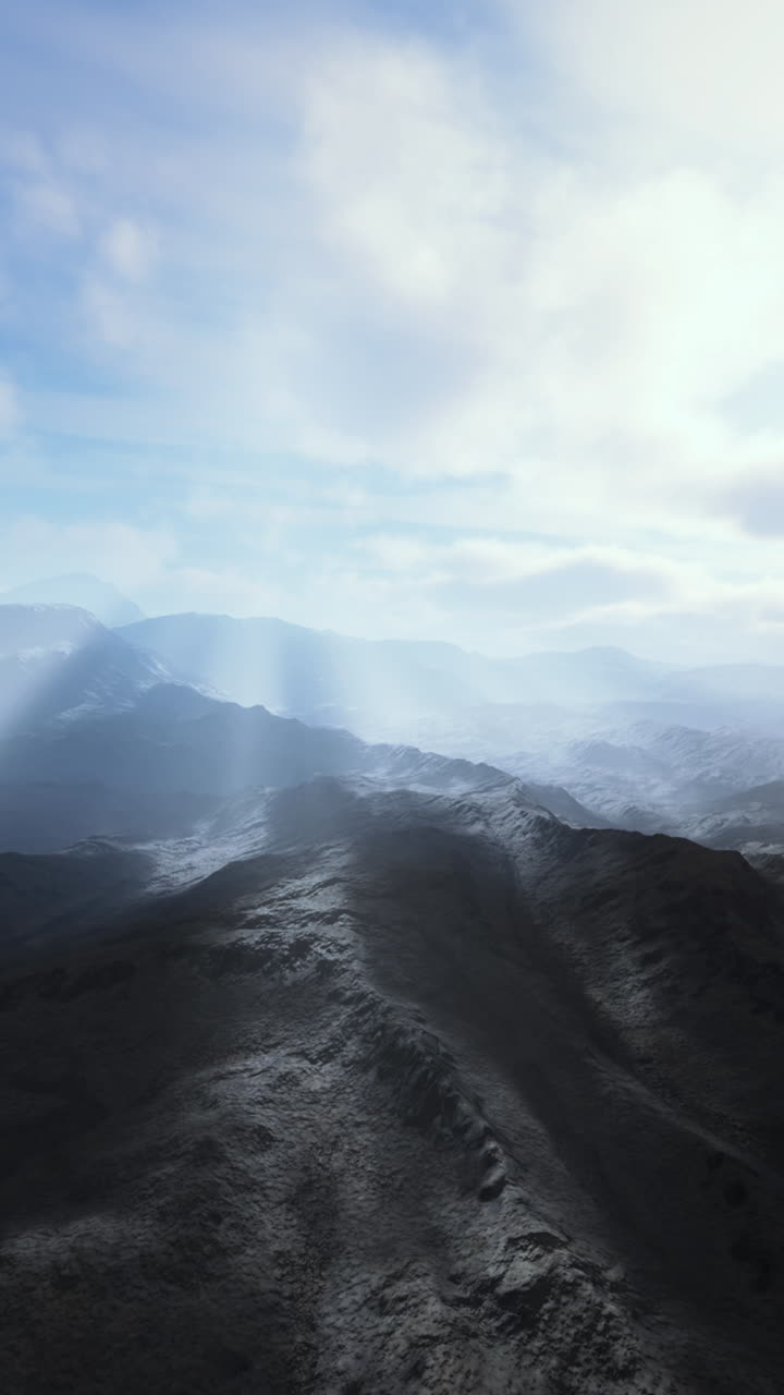 Alpine chains shrouded in the morning fog