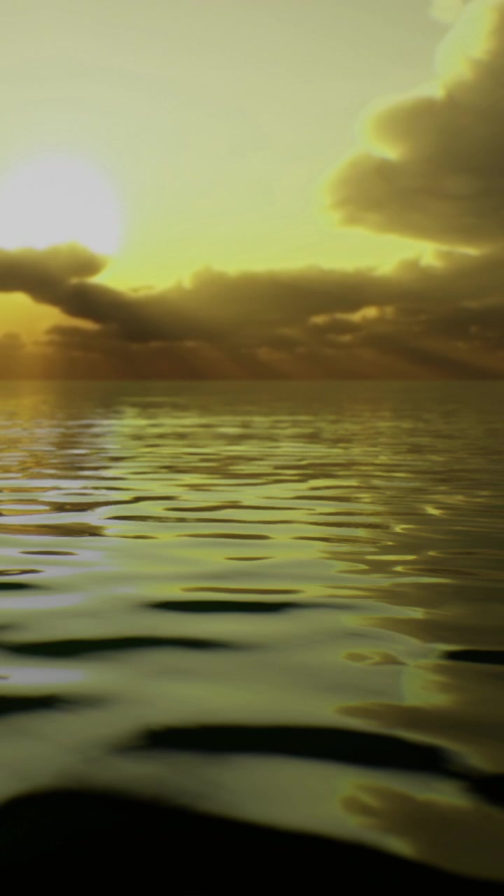 Calm water reflects clouds and light during sunset near the horizon