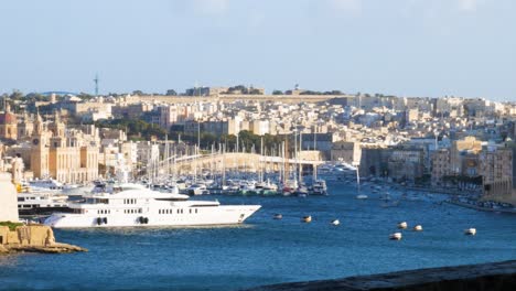 Superyacht-moored-in-harbor-of-Valletta,-Malta-island