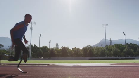 Disabled-mixed-race-man-with-prosthetic-legs-running-on-race-track