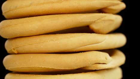 traditional bossola bagels stack turns on black background