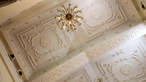 artistic decorations and drawings on the ceiling of the interior church - low angle