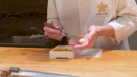 chef crafting sushi with precision and care