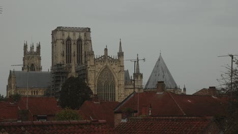 hand-held shot of york minster on a overcast day and houses in the foreground