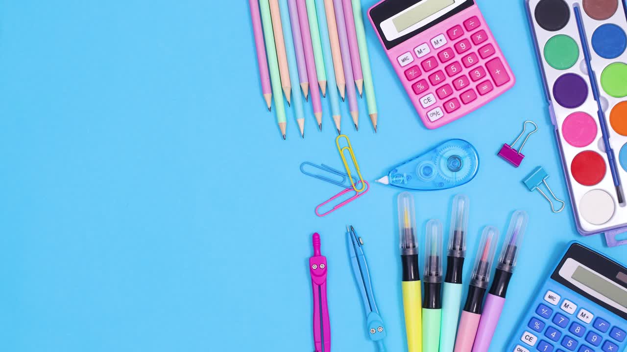 Pastel school accessories move on right side of blue theme. Stop motion
