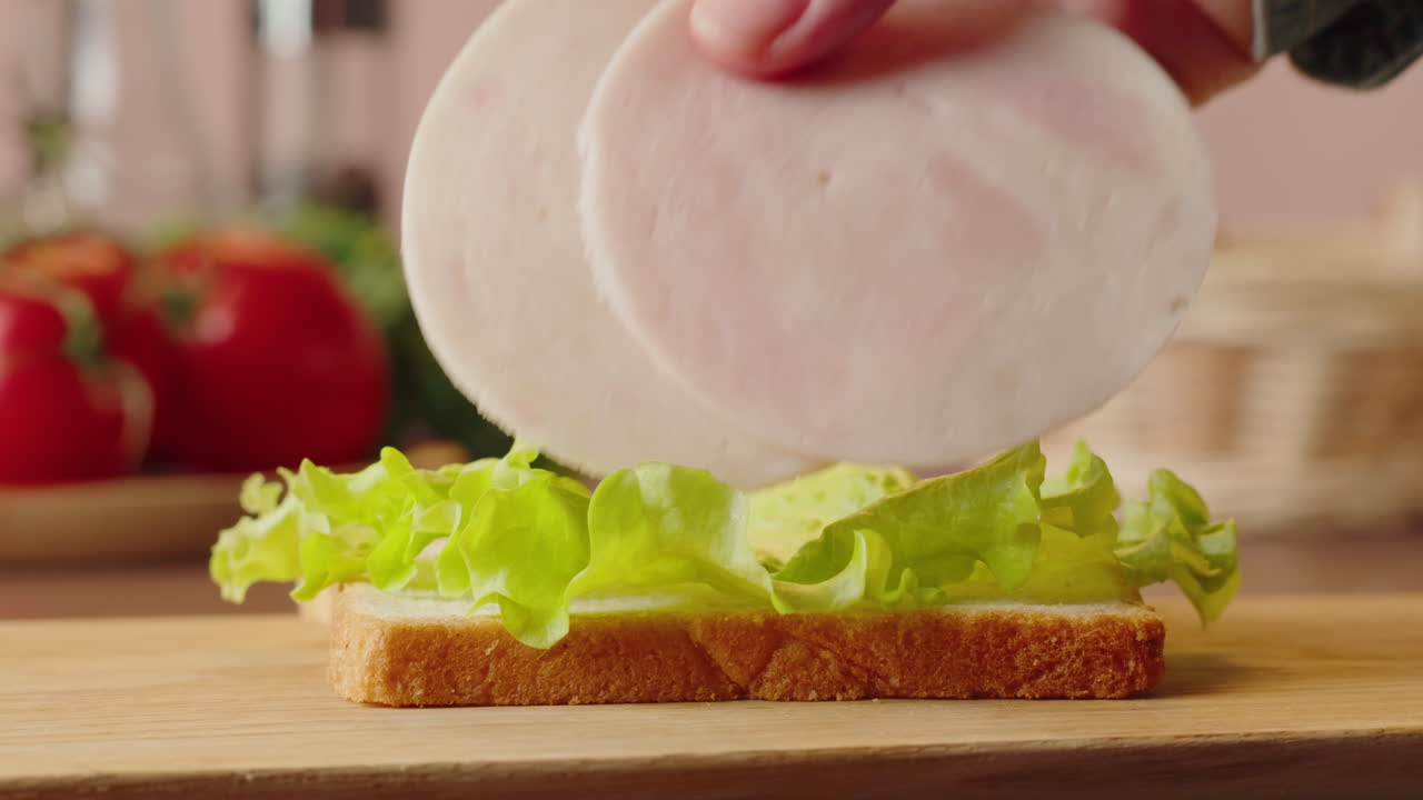 Making a Ham and Lettuce Sandwich