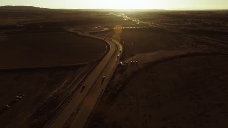 aerial shot of highway in spain, cars and trucks driving by