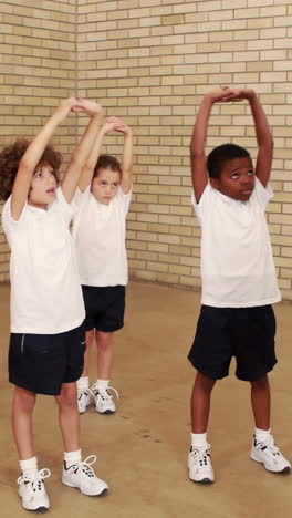 pupils and teacher during sports lesson