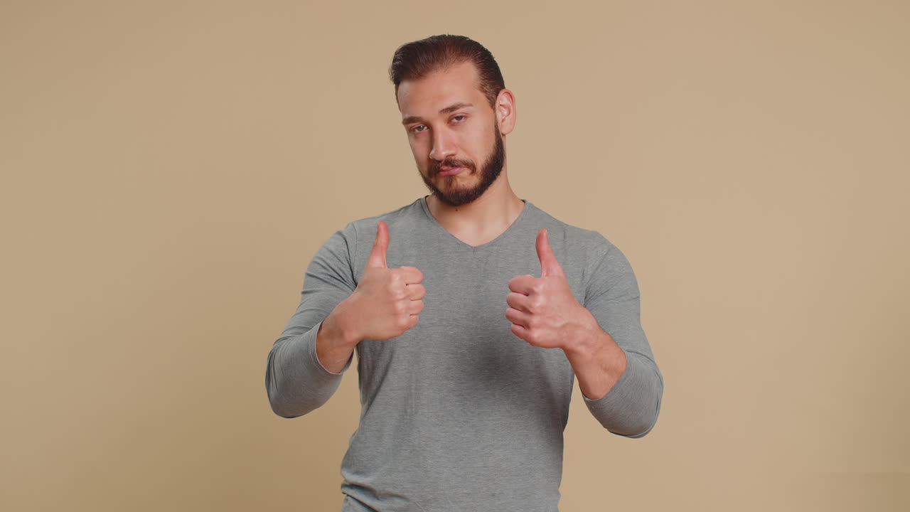 Lebanese man pointing to camera and happy expression making choice showing direction find winner