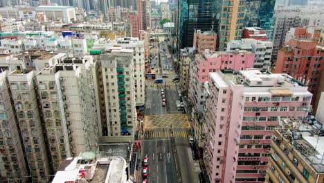 downtown hong kong buildings, crosswalk and traffic, high altitude aerial view