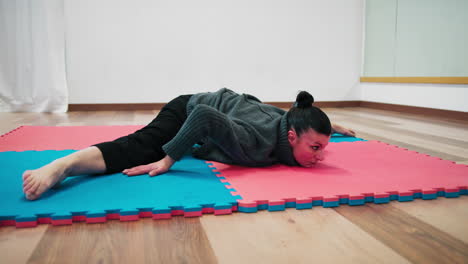 Relaxation Spirit Yoga Position On Tatami In Gym After Workout Sports