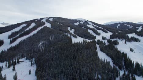 ski and snowboard runs on the side of a snowy mountain in colorado