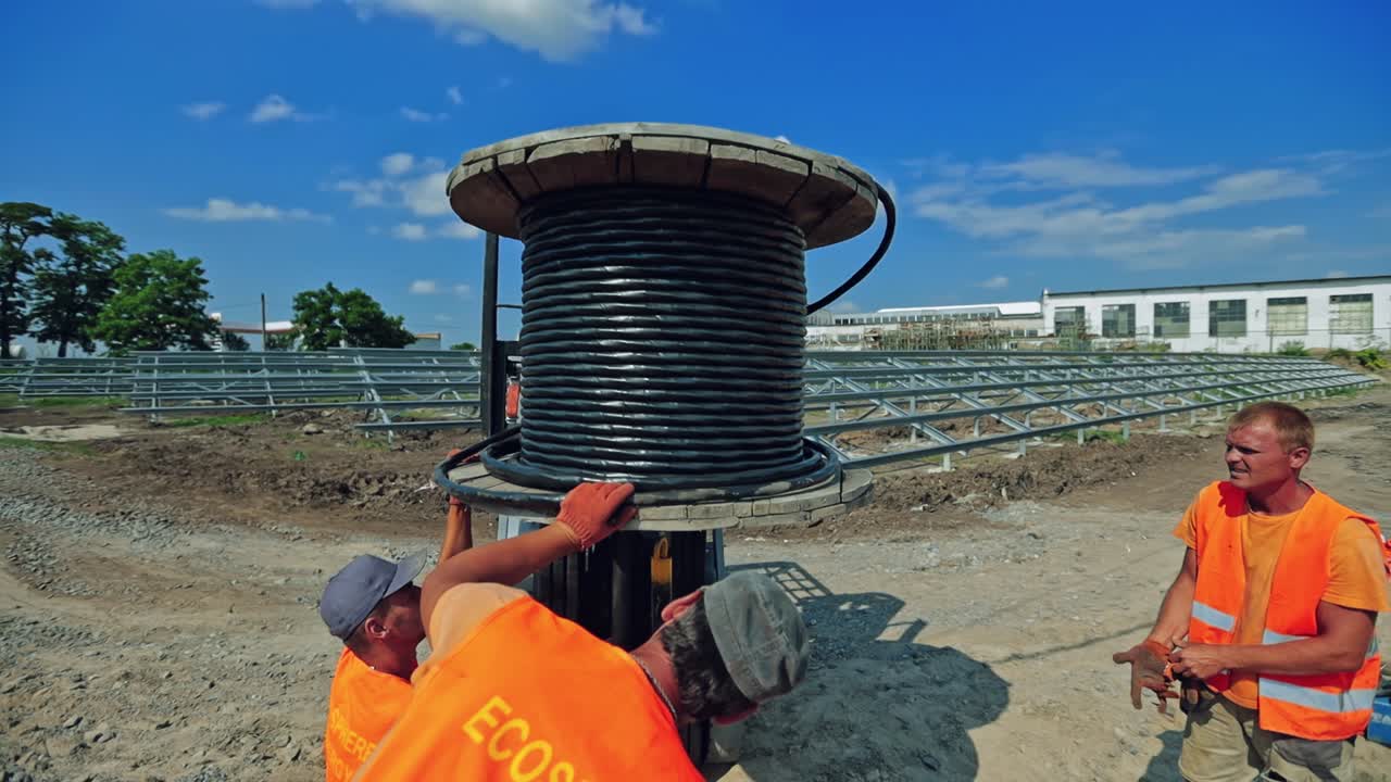Construction site workers. Construction workers collaborating in the installation