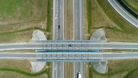 drone view of highway and overpass in the city