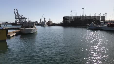 A-cinematic-morning-view-of-an-anchorage-of-boats-and-yachts-in-the-bay-of-a-beach