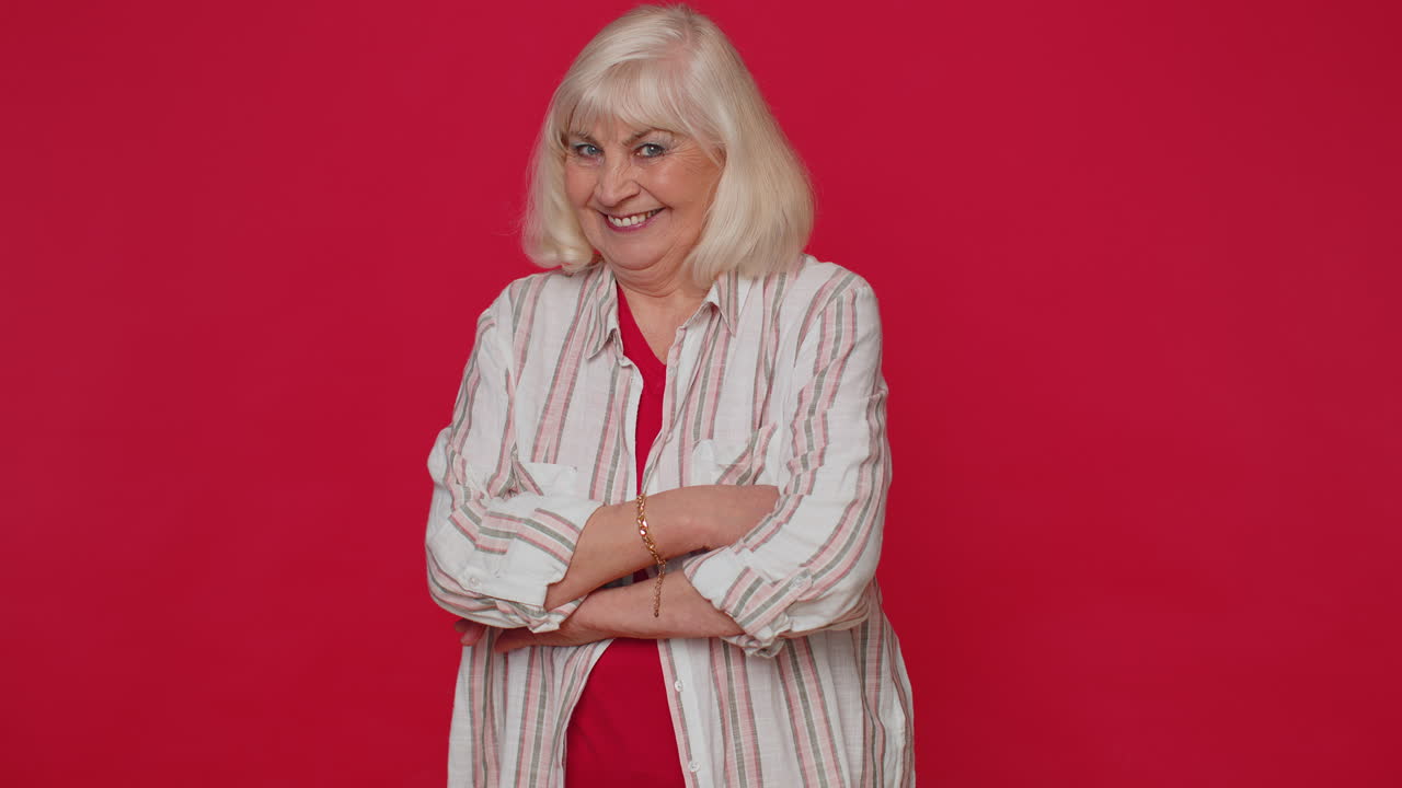 Lovely cheerful senior woman approves suggestion shaking head approvely satisfied, good work, like