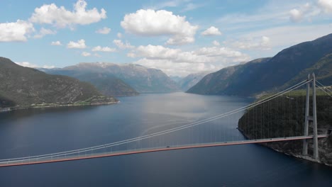 aerial: amazing suspension bridge in eidfjorden norway, hardanger bridge 4k view