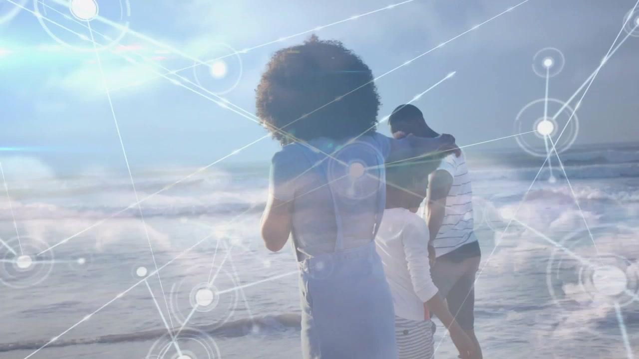 Video verticale: Famiglia che cammina verso il mare mentre l'inquadratura si allontana, con una sovrapposizione di nodi che mostrano collegamenti tecnologici.