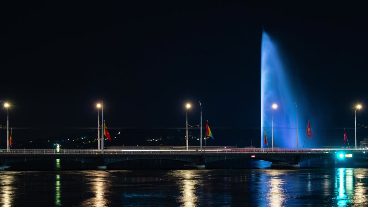 night illuminated geneva city traffic bridge lake famous fountain panorama 4k timelapse switzerland