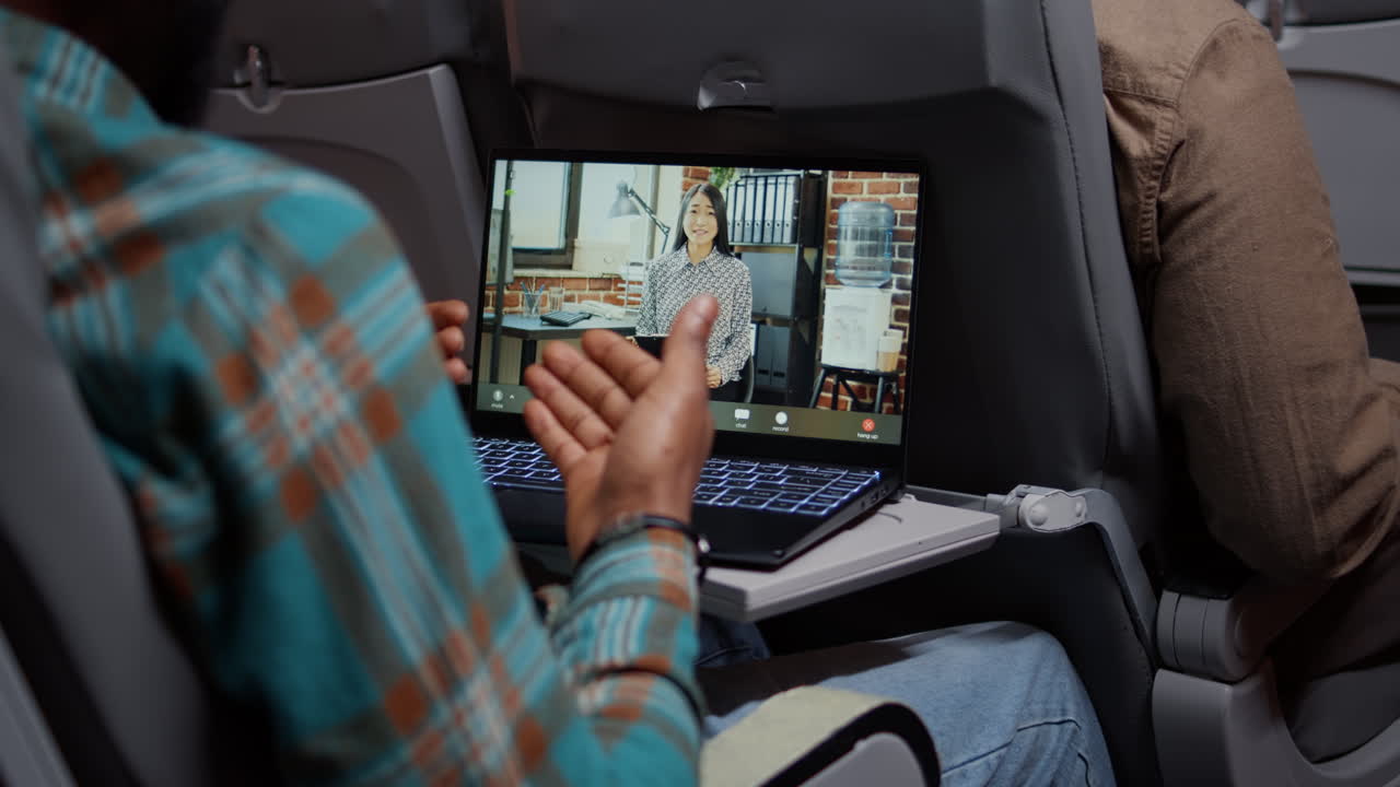 Male freelancer using remote videocall telework to chat with woman