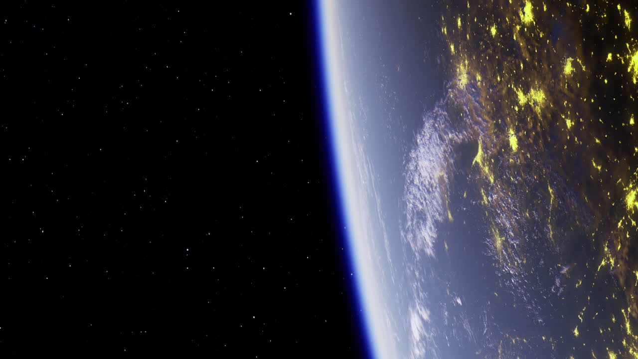 View of earth from space showing lights and atmosphere at night
