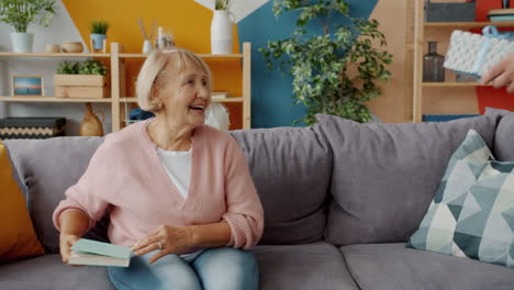 elderly couple sharing a gift