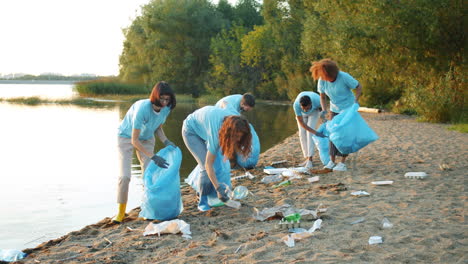 community volunteers cleaning up a riverbank