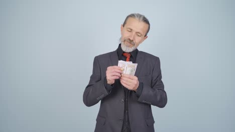 rich businessman counting money.