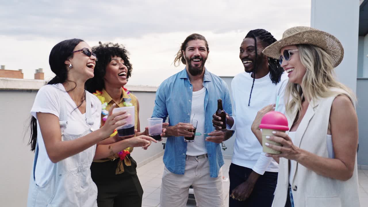 Group of friends celebrating and enjoying a party on a rooftop