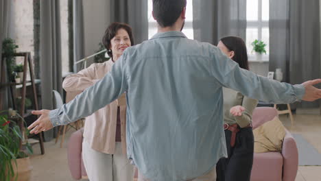 family greeting with a hug