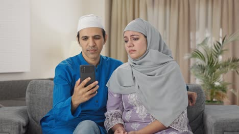 angry muslim couple talking their child on video call