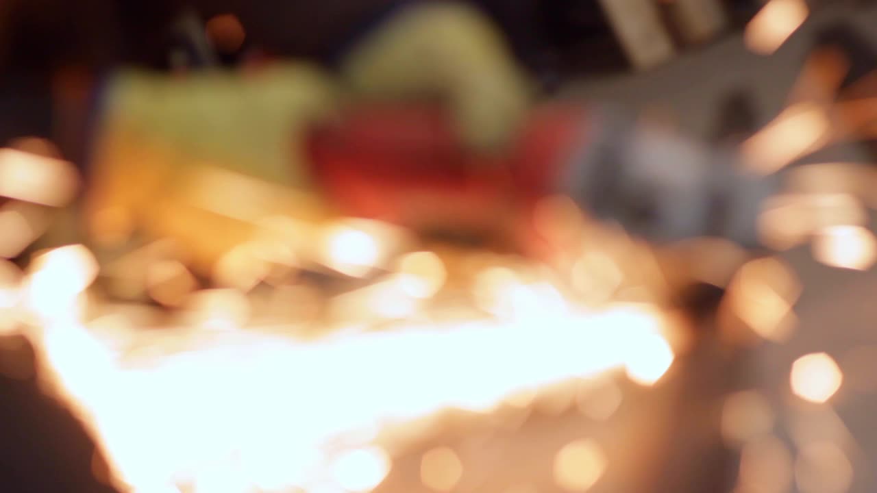 Sparks from a angle handsaw grinder blurred shot, closeup