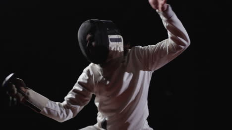 a fencer in action during a competition