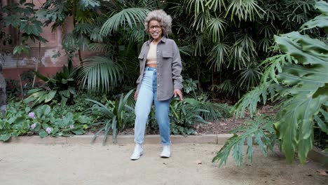 a woman dancing in a park