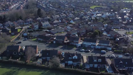 Typical-Suburban-village-residential-Ireland-neighbourhood-property-rooftops-aerial-view-dolly-right