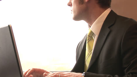 businessman working on a train