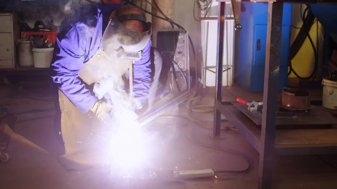 Welder welding a metal