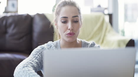woman, thinking or laptop typing in house