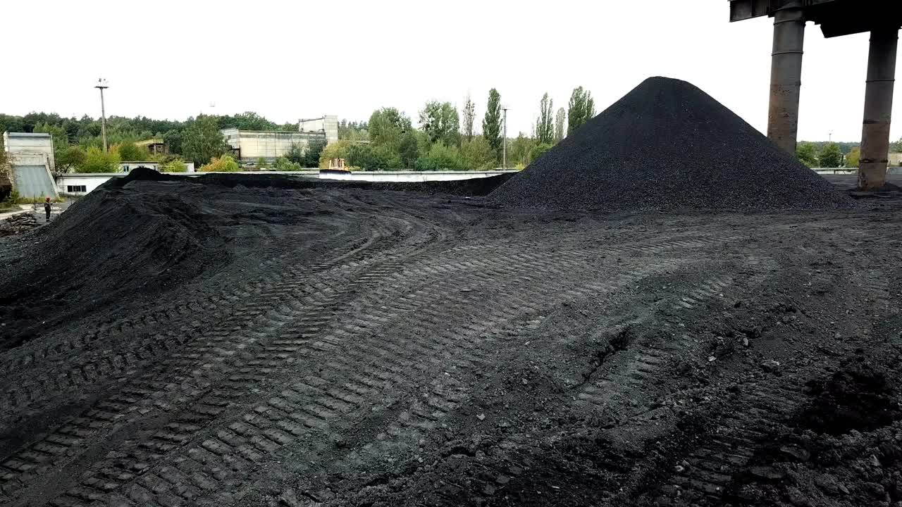 Multi-ton bulldozer works. Extractive industry, anthracite. Aerial view.