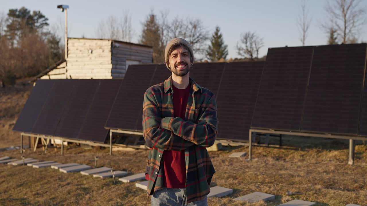 Man standing in front of solar panels
